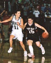 Lisa Lambert shadows Bishop Ward's Urse Charbonneau during De Soto
High School's loss to K.C. Ward in the sub-state semifinals. It was
the last game for Lambert and her fellow seniors who led the
Wildcats a Kaw Valley League championship and a mid-season
tournament crown at Louisburg.