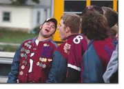Josh Barr shouts "Go" with the rest of the Cardinal athletes in
anticipation of a shout of "Cards" from sports fans attending the
Eudora High School homecoming pep rally and bonfire.