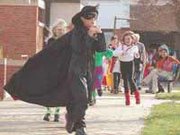The masked man at Nottingham Elementary School's costume parade was
none other than first-grader Calvin Smoot.