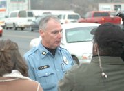 Kansas City, Kan., Police Maj. Donald Ash speaks with the media at the conclusion of Tuesday's police chase that started in Kansas City, Kan., passed through Lansing and ended in Leavenworth. The low-speed chase ended when police forced the suspect's Jeep off the road.