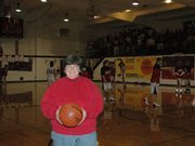 Former Lansing High girls' basketball coach Carol Caplinger catches a game at the Lansing Intermediate School gym where she coached the LHS girls during the 1987-88 season, the final season high school hoops was played in the old gym.