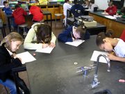 Lansing Intermediate School fourth-graders work on conservation drawings in the LIS art room, originally a science lab when the school was Lansing Rural High School. This converted space is one of many that school bond proponents say could be fixed by building a new elementary school.