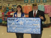 Jodi Morris-Neville, a Wal-Mart assistant manager, presented a check for $2,000 to Mike Howell, senior vice commander for Lansing VFW on Tuesday. "Wal-Mart felt giving a donation was good for the community," Morris-Neville said. She said groups must apply for donations. Applications can be found online, she said. Howell said the money would be added to funds that are used to help veterans.
