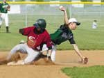 De Soto infielder Austin DeGraeve gets a force out on Eudora's Mark
Abel but is unable to complete the double play in the first game of
a doubleheader Tuesday that determined the Frontier League
championship. The visiting Cardinals won an 11-9 slugfest and
prevailed in the second game as well. The Wildcats now move on to
the 4A regional where they face Piper at 3 p.m. Monday at the
T-Bones stadium in Kansas City, Kan. De Soto finished the regular
season 13-7.