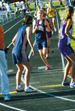 As she prepares to hand off to Johanna Rahmqvist, Lauren Colman
finishes her leg of the 3,200-meter relay in first, a position the
Eudora Cardinals girls found themselves in most of the day at the
4A regional meet Friday in Tonganoxie. The team of Rahmqvist,
Brittney Graff, Megan Ballock and Colman won the event, helping the
girls squad net the team title.