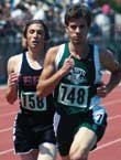 Wildcat senior Casey Johnson sets the pace in the 1,600-meter run
at the state championship track finals Saturday in Wichita. Johnson
won the event and successfully defended his 800 title, too.
Although he failed to achieve his goal of adding golds in the 400
and 3,200, Johnson finished second in the 3,200.
