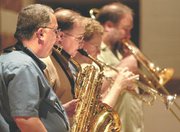 Kerry Strayer and The New Kansas City 7 Band performed a collection
of jazz standards. The threat of rain forced the concert inside to
the Basehor-Linwood High School auditorium.