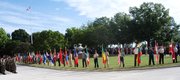 Officers from 68 foreign armies line up with their country's flag during the opening ceremony for this year's Command and General Staff College at Fort Leavenworth. The ceremonies were Monday at Abram's Loop at the fort.