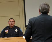 Lt. Ben Ontiveros of the Lansing Police Department is questioned on the witness stand during the trial of the man suspected in the December 2004 robbery and rape of a clerk at Wood Oil Co. A mistrial was declared, and a new trial set for Nov. 14.