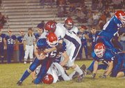 Todd Roberts blows up a running play, tackling Santa Fe Trail's
running back Chris Sadler Friday. Eudora beat the Chargers 36-6 to
remain undefeated, 7-0, on the season and to get a quick start in
district play.