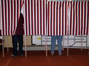 Voting booths like these slowly will be phased out as Leavenworth County begins purchasing electronic voting machines.