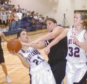 Nikki Snider works for a shot Friday. The girls beat Louisburg
57-42, the team's fourth-straight win.