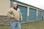 Hank Koch stands outside the Ensign Storage Facility in Bonner Springs. Koch led authorities to the van used by Toby Young to smuggle inmate John Manard from Lansing Correctional Facility on Sunday.