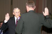 Retired Lt. Gen. Robert Arter takes the oath of office from Lt. Gen. Robert T. Clark, Fifth Army commanding general at Fort Sam Houston, Texas, at Arter's Civilian Aide to the Secretary of the Army investiture ceremony Feb. 22, 2006, at Fort Leavenworth.