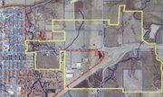 A possible TIF district in yellow stretches outside the city
limits, which are marked in red to the east of East 10th Street.