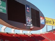 Tom and Ryan Young of Young Sign Co., Leavenworth, work on a sign on the west scoreboard at Arrowhead Stadium. Though Young Sign Co. had done work previously at Verizon Wireless Amphitheater and Kemper Arena, this is the first time it has worked at Arrowhead.