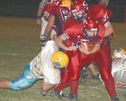 Ryan Fisher pushes his way through the Central Heights defense
Friday as Eudora knocked off the Vikings, 34-0.
