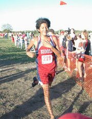 Eudora senior Joey Chino cracks a smile Monday after finishing
first in the five-kilometer varsity boys race at the Tonganoxie
Invitational. Chino finished the course in 17:21.