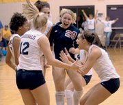 The Eudora girls volleyball team celebrates after a point late in
Saturday's sub-state finals match. The team beat St. James Academy
in three games and the Cardinals are going to the state tournament.