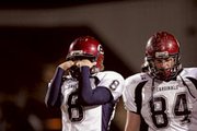 Eudora senior Kent Swanson (8) and junior Morgan Abel can't watch
Friday as the Girard Trojans celebrated a 21-14 win that will pit
them against Paola in the Class 4A state semi-finals. The
season-ending loss was Eudora's first of the season.