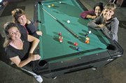 There may be fewer women than men who are serious pool players in competitive leagues. Yet these women, who play pool together, who cheer each other on, and who continue to rack up the points, are confident and comfortable at the pool tables. Pictured clockwise from lower left are, Keleigh Scheuermann, Lin Davis, Nicolette Ducey and Terry Mitchener. The women also have careers and interests outside the pool hall. Scheuermann makes pottery, Davis is an analyst for Sprint Nextel, Ducey works at an Olathe dental lab where she's immersed in the intricacies of making crowns and bridges, and Terry works for Holliday Sand and Gravel in Bonner Springs.