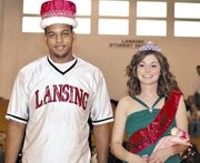 Lansing High School seniors Jeff Jackson, left, and Bianca Manago were crowned Winter Royalty king and queen on Friday night at halftime of the LHS boys basketball game against Turner.