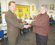 Sunflower Broadband director of sales and support Joe Ryan presents
a check Tuesday to Pennie von Achen of the Eudora Endowment
Association for $530 as part of Sunflower Broadband's Sunflower for
Schools program.