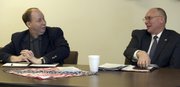Rep. Kenny Wilk, left, a Lansing Republican, shares a joke with Sen. Roger Pine, R-Lawrence. The two appeared this past weekend at a legislative forum in Tonganoxie.