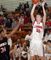 Clayton Hall, Lansing High sophomore, puts up a three-point attempt Thursday night against Bonner Springs. Hall sank five treys in the game and scored 19 points as LHS lost, 36-35, in the first round of the Class 5A substate tournament.