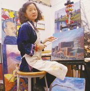 Alice Kuo takes time between her work for the Transportation
Research Institute at Kansas University, a teaching position at
Johnson County Community College and a weekend job reporting for
the Chinese language World-Journal to focus on her projects in her
studio on KU's campus.