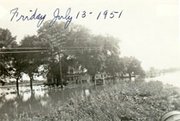Flood waters from a swollen Kansas River encroach on an area of De
Soto just east of what is now the east-Y. The stately home in the
foreground is identified as that of Ralph and Fred Morse.