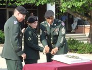 Brig. Gen. Mark E. O'Neill (left), Pfc. Nicole Murphy (center) and Command Sgt. Maj. Jonnie Jones cut a birthday cake with a saber in a ceremony Thursday, June 14. The celebration marked the 232nd birthday of the U.S. Army.