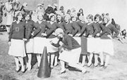 Flapper power worked the sidelines for De Soto High School in 1929.
This photo of that year's DHS Pep Club was provided to Kathy Ross
by Bruce Blaylock, who could not identify his mother Nadine among
the girls, father Howard in the background nor any of the girls in
the pep squad.