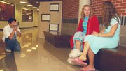 Connor Hartpence tapes Heather Whitten and Kim Scherman Monday.
Video yearbook participants led by the Hartpence brothers attend
games, visit clubs and school events to pull together material for
the yearbook.