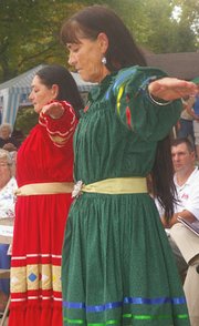Sherryl Marable and Leota Burnett perform "The Lords Prayer"
Saturday before the unveiling of the Eudora and Paschal Fish
statue. Marable and Burnett are Paschal Fish's direct descendants.