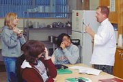Eudora High School students Ashley Ingwerson, Heather Summers and
Miranda Cobell talk with culinary arts instructor Jason Gray about
the pumpkin soup their class made at the Eudora - De Soto Technical
center located at 1002 Elm St. in Eudora.