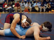 Eudora senior Evan Meyers wrestles Garrett Roecker of Chanute
Friday in the Eudora Tournament of Champions. Meyers aimed to
become a champion himself, but came up just short. After advancing
through an eight-man bracket Saturday, Meyers fell in the title
match to Jerry Cox of Sumner Academy, 9-3.