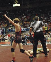 Dennis Wood celebrates after knocking off previously undefeated defending state champion John Keller of Wichita Bishop Carroll in the 103-pound semifinals at the Class 5A state wrestling tournament. Wood ultimately placed second at state, as did teammates Kyle Buehler (140 pounds) and Nick Flynn (145 pounds). This marked the second straight year LHS placed three wrestlers in the state finals.