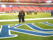 Claudia Alterman, left, and Kyrstan Perry had field access to Thursday's Orange Bowl as KU football equipment managers.