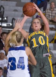 Senior Brooke Sanders goes up for two points against the Holton defense Thursday night in semifinal action in the Bobcat Basketball Invitational tournament. Sanders had 10-points for the night.
