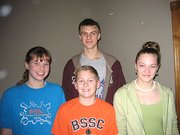 Four Lansing students earned a total of 12 medals in the Missouri Valley Swimming Championships, Feb. 22 - 24, in Lawrence. They are, front row, from left: Hannah Hecht, Matt Holden, Shyann Winkler, and back row, Kurt Weber. Weber, Lansing High sophomore, placed second in the 200-yard butterfly (2:20.42), third in the 200-yard individual medley (2:10.08), third in the 400-yard individual medley (4:39.90), fourth in the 100-yard butterfly (1:00.76), fourth in the 100-yard freestyle (53.74), fifth in the 200-yard freestyle (1:58.40) and sixth in the 50-yard freestyle (24.53). Hecht, LHS freshman, placed seventh in the 200-yard breaststroke (3:03.32). Winkler, Lansing Middle School eighth-grader, placed first in the 50-yard freestyle (27.58), sixth in the 100-yard freestyle (1:01.55) and eighth in the 200-yard backstroke (2:37.62). Holden, Lansing Elementary School student, placed seventh in the 100-yard backstroke (1:39.97).