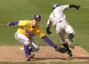Basehor senior Travis Inlow is tagged out on a run to second by Spring Hill's Patrick Donahue in the fifth inning Friday.