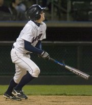 In the fourth inning of Friday night's game, St. James junior Alan Burns looks as he sends the ball deep into center that resulted in a triple against Bonner Springs.