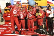 Dan Wheldon, standing on his car, celebrates after winning the Road Runner Turbo Indy 300. Wheldon repeated as Kansas Speedway IndyCar champ Sunday.