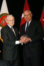 Retired Army Lt. Gen. Robert Arter, chairman of the Command and General Staff College Foundation, presents Colin L. Powell with the CGSC Foundation Distinguished Leadership Award at a dinner banquet in Kansas City, April 29. Powell, former Secretary of State and Chairman of the Joint Chiefs of Staff, was in Kansas City as part of a two-day trip to deliver the inaugural lecture for the Colin L. Powell Lecture Series at the U.S. Army Command and General Staff College, at Fort Leavenworth.