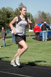 Baldwin High School sophomore Connor Twombly runs the leadoff leg of the 3,200-meter relay Friday at the Redbud Classic.