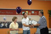 Baldwin Supt. Paul Dorathy, right, shakes Doug Woolery's hand Friday morning. Woolery and Donna Reed were two recipients of the Baldwin Education Foundation Innovative Project Grants. Both are teachers at the Baldwin Elementary School Intermediate Center.