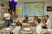 Marilee Valentine, Baldwin Junior High School eighth grade social studies teacher, explains her idea that earned her an Innovative Project Grant to one of her classes Friday morning.