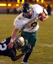 On Third and fifteen to go in the first quarter, Basehor quarterback Brandon Leppke is tripped up by a Turner defender but after gaining 12 yards on the play.
