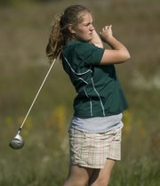 Rachel Van Fleet watches her ball leave the tee box area of the fifth hole Thursday in the Basehor-Linwood Girls Golf Invitational.